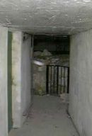 le passage sous la motte permettant d‘éccéder aux fondations, anciennes et nouvelles